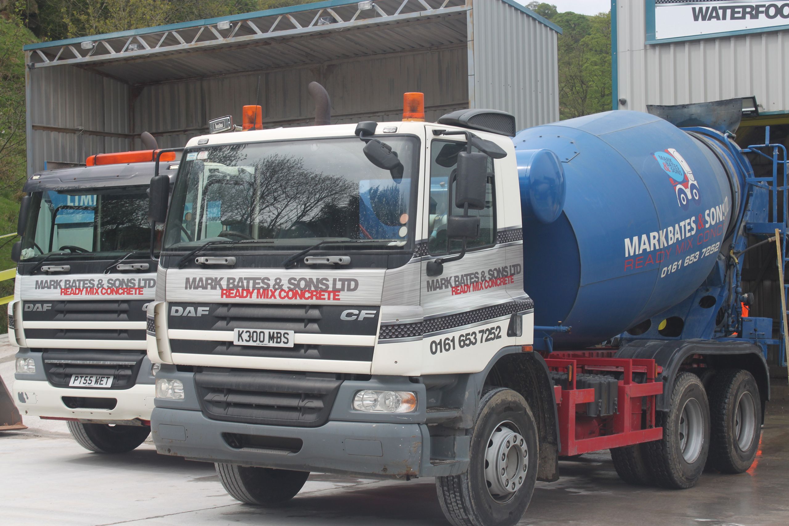 An image of two Mark Bates & Sons Ltd concrete trucks